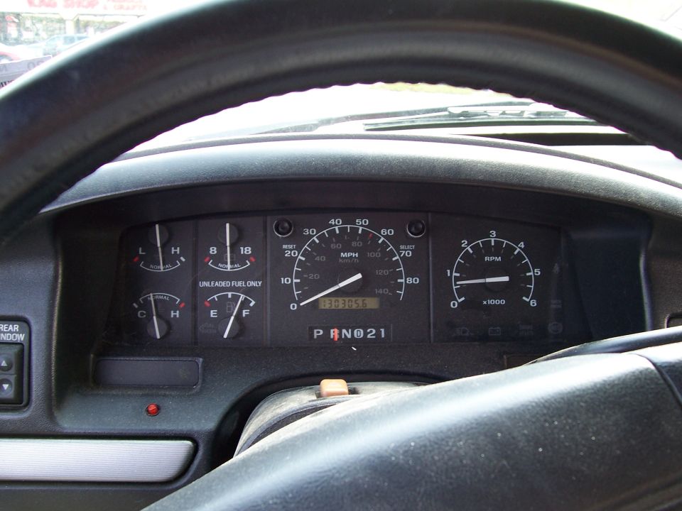 Dashboard gauges of a 1995 Ford Bronco showing 130,305 miles