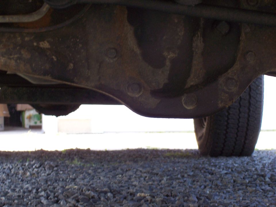 Underside of vehicle rear axle and tire