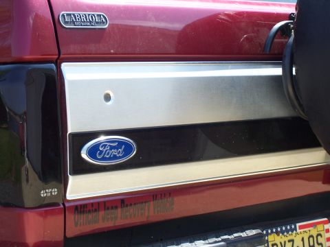 1995 Ford Bronco - Close-up of the rear panel of a Ford Bronco, a Ford emblem and a 'LABRIOLA' badge.