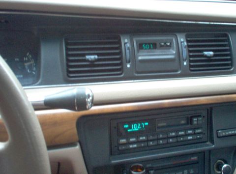 1994 Ford Crown Victoria - This is where I plan to mount the tachometer, but I haven't decided if I'll cut out the entire clock panel & replace it with a black steel…