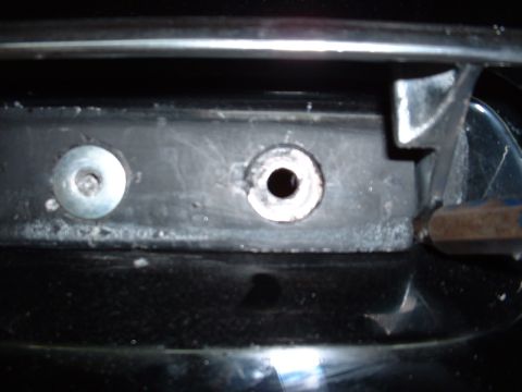 1978 Ford Mustang II - Detail of a vehicle's front grille mounting area, showing attachment points.