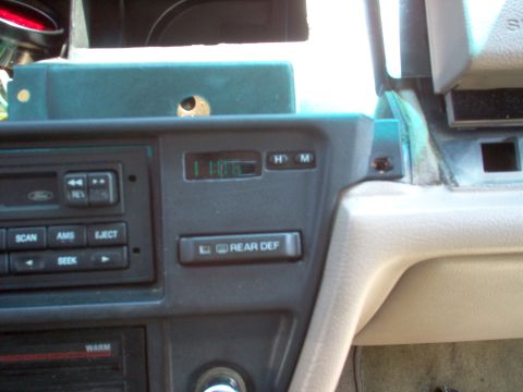 1994 Ford Crown Victoria - The reflection of the camera in the clock lens is a distraction, and the photo makes the edges of the holes look rougher than they are. It…