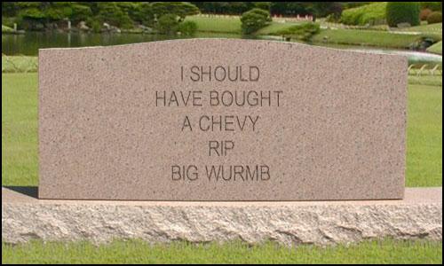 Cemetery headstone engraved 'I SHOULD HAVE BOUGHT A CHEVY RIP BIG WURMB' on a lawn