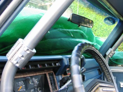 1985 Ford Bronco - The Ford logo is visible on the windshield, suggesting it's a Ford vehicle, but the interior details do not match a 1985 Bronco.