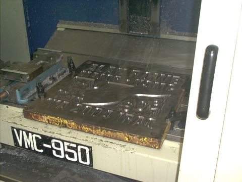 1966 Ford Bronco - A metal stamping die is secured in a VMC-950 milling machine for manufacturing.