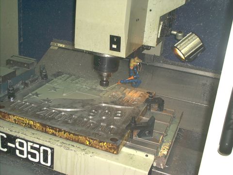 1966 Ford Bronco - CNC machine engraving a custom metal plate with text and star designs.