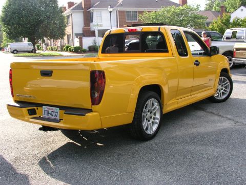 2005 Chevrolet Colorado - This yellow 2005 Chevrolet Colorado pickup truck is seen from the rear 3/4 angle.