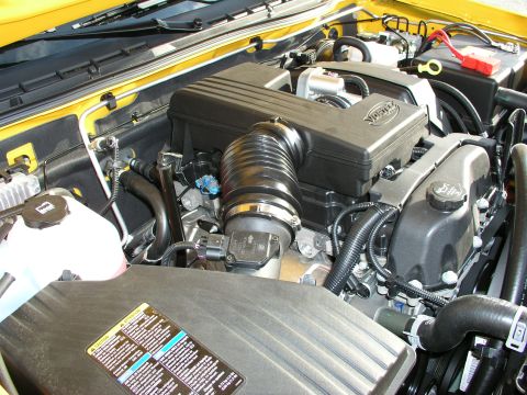 2005 Chevrolet Colorado - Close-up of the engine bay in a 2005 Chevrolet Colorado, showing the air intake system and engine cover.