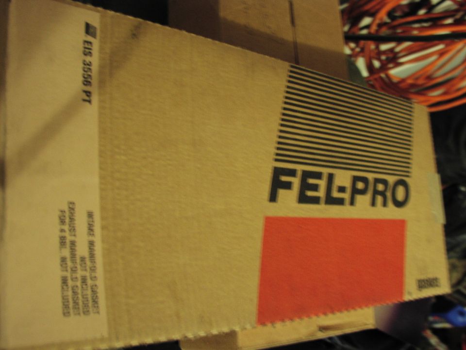 Cardboard box for Fel-Pro gaskets, part number EIS 3556 PT. Text indicates it is for an intake manifold and exhaust manifold gasket set