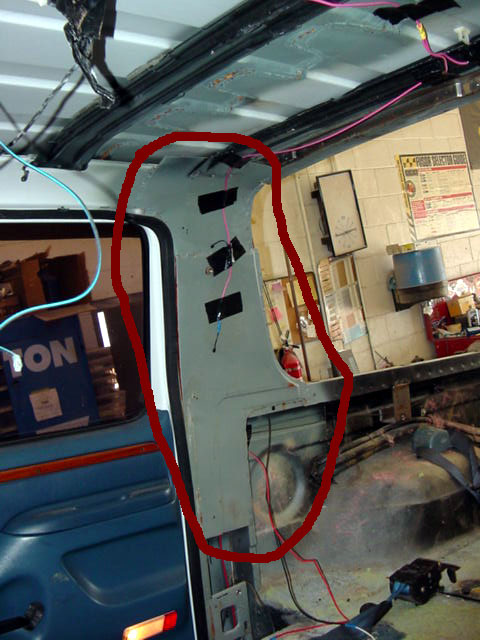 1994 Ford C-350 (Centurion Conversions) - Vehicle interior showing the A-pillar and roof framing during what appears to be a renovation or repair process.
