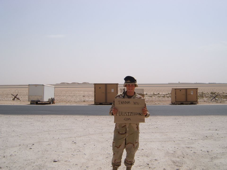 soldier in desert holding sign that says thank you fullsizebronco.com