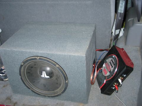 1995 Ford Bronco - Aftermarket audio equipment is installed in the rear of a vehicle.