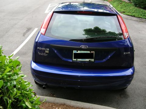 2005 Ford Focus - Blue 2005 Ford Focus ZX5 hatchback parked in a lot, showing rear details and a Tennessee license plate.