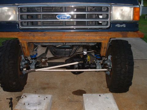1995 Ford Bronco - Front view of a 1995 Ford Bronco, highlighting its suspension and a custom-made bumper.