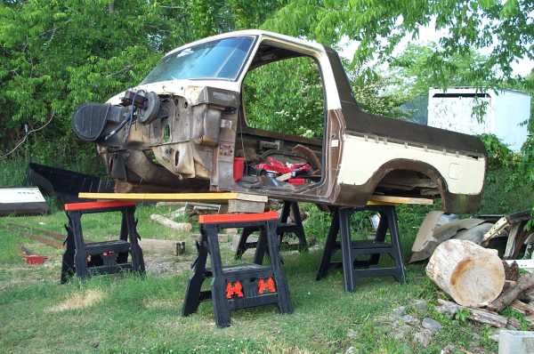 Disassembled 1979 Ford Bronco body on sawhorses, side view
