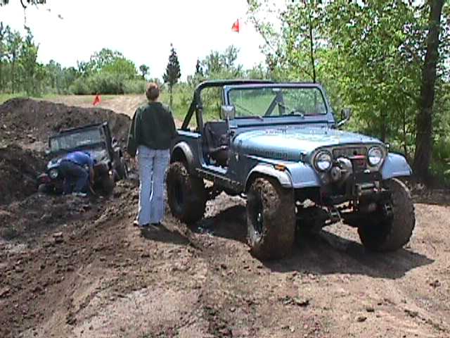 Blue 1984 Jeep Wrangler with winch and off-road tires