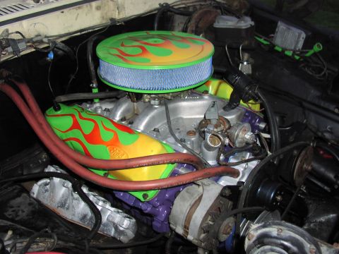 1979 Ford Bronco - The engine bay features a V8 engine with custom flame-painted valve covers and air cleaner lid.
