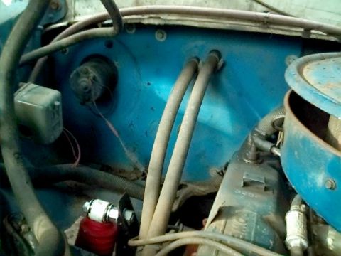 1978 Ford Bronco - Heater core tubes and blower motor assembly visible in the engine bay.