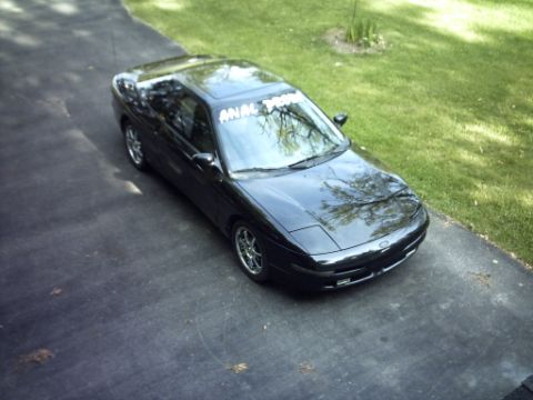 1995 Ford Probe - 1995 Ford Probe with a windshield banner parked on a driveway.