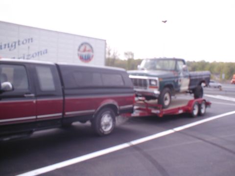1979 Ford Bronco - A 1979 Ford F-Series pickup truck is transported on a trailer, with another truck visible in the foreground.