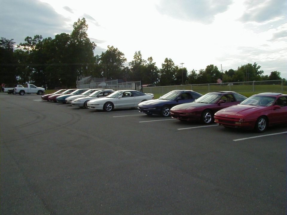 Line of 1994 Ford Probes parked side-by-side