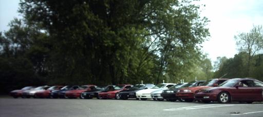Line of cars parked side-by-side