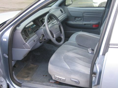 2001 Ford Crown Victoria - Interior view of a 2001 Ford Crown Victoria, highlighting the driver's seat and dashboard.