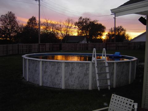 1991 Ford Bronco - Backyard swimming pool reflects the vibrant colors of the sunset.