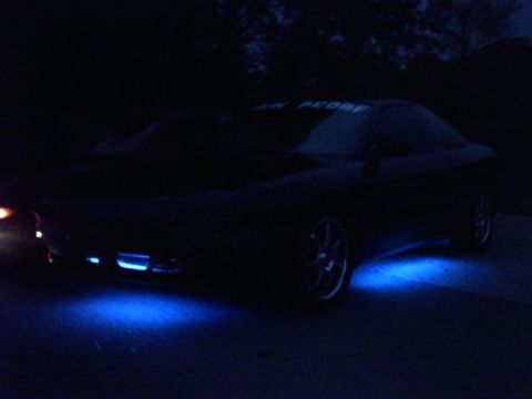 1995 Ford Probe - This 1995 Ford Probe has custom blue underglow lighting and text on the windshield.
