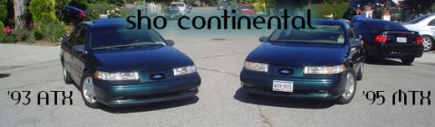 1995 Ford Taurus - Two Ford Taurus sedans, one from 1993 and another from 1995, are parked side-by-side.