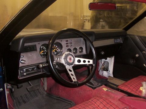 1978 Ford Mustang II - Interior view of a 1978 Ford Mustang II, an aftermarket steering wheel and custom seat upholstery.