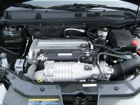 1998 Ford Taurus - The engine bay features a prominent supercharger, indicating enhanced performance.