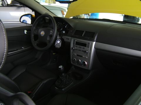 1998 Ford Taurus - Interior view of a car, showing the dashboard, steering wheel, and seats. The Chevrolet logo is visible on the steering wheel.