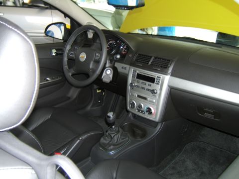 1998 Ford Taurus - Interior view of a car's dashboard, steering wheel, and front seats.
