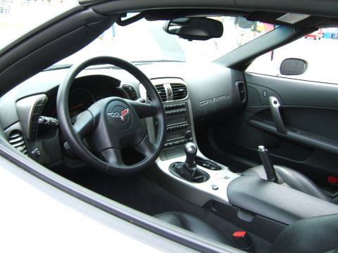 1998 Ford Taurus - The interior of a Corvette shows a manual transmission and dashboard details.