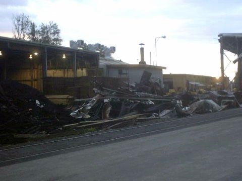 1995 Ford Bronco - Scene of an industrial area with significant debris and damaged structures.