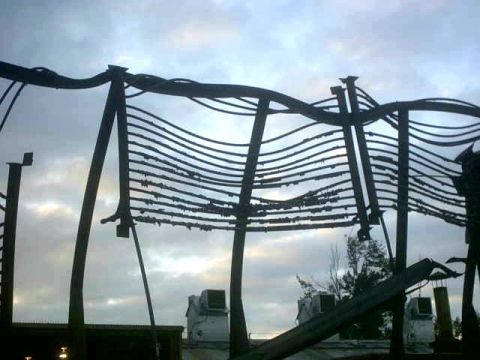 1995 Ford Bronco - Damaged overhead power lines are silhouetted against a cloudy sky, with some debris visible on the wires.