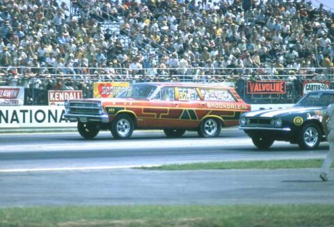 1967 Ford Fairlane - A vintage station wagon competes in a drag race, with spectators filling the stands.