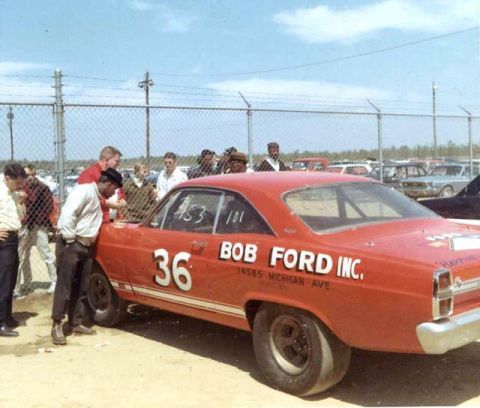 1967 Ford Fairlane - A 1967 Ford Fairlane race car, number 36, with "BOB FORD INC." branding, sits at the track with spectators nearby.