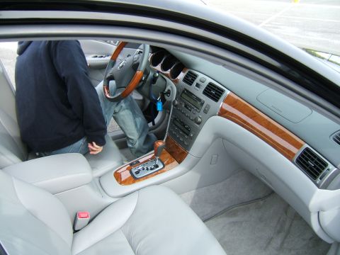 1998 Ford Taurus - Interior view of a car, showing the dashboard, center console, and seats.