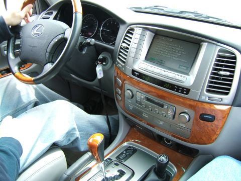 1998 Ford Taurus - Interior view of a car's dashboard, showing the steering wheel, center console, and navigation screen.
