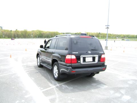 1998 Ford Taurus - Rear view of a black Lexus LX 470 at an outdoor event with cones set up.
