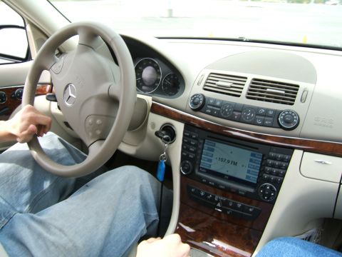 1998 Ford Taurus - Interior view of a Mercedes-Benz, focusing on the steering wheel, dashboard, and center console.
