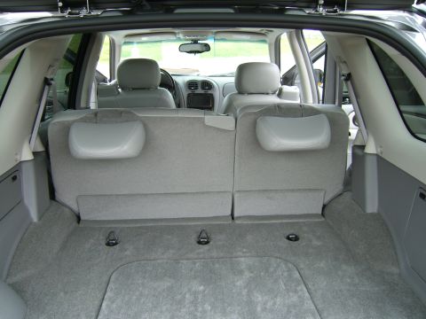 1998 Ford Taurus - View from the rear cargo area of an SUV, looking towards the front seats and dashboard.