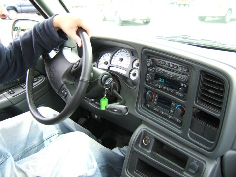 1998 Ford Taurus - The interior of a Chevrolet Silverado, the dashboard, steering wheel, and center console with radio and climate controls.
