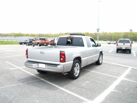 1998 Ford Taurus - Silver pickup truck parked in a lot with other vehicles visible in the background.