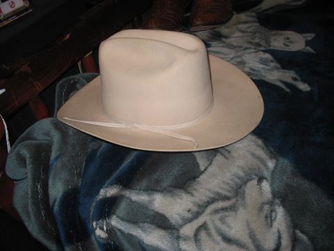 1986 Ford Bronco - Cowboy hat and boots on a wolf-themed blanket.