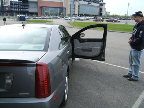 1998 Ford Taurus - A gray sedan is parked with its driver's door open, revealing the interior.