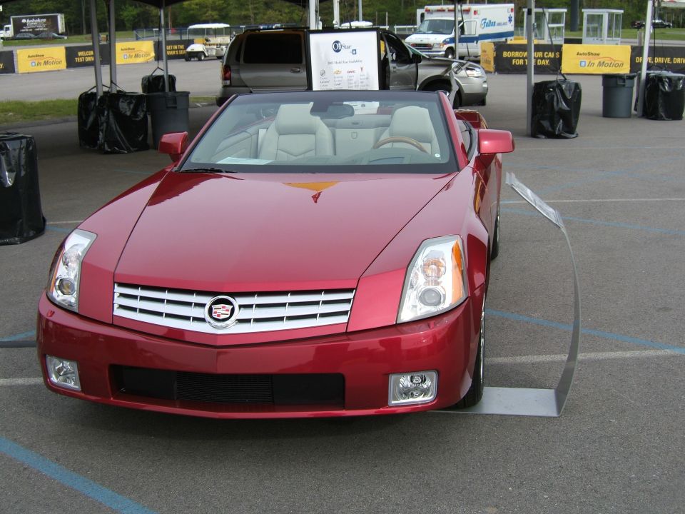 Red convertible with tan interior, front view
