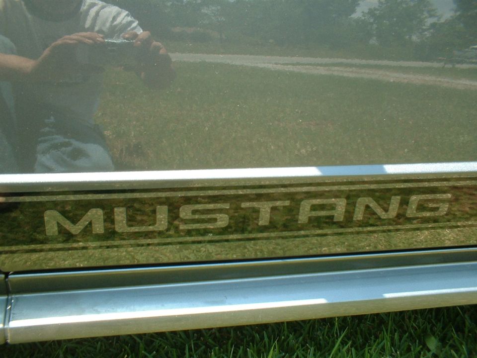 Mustang door sill plate with reflection of person holding camera